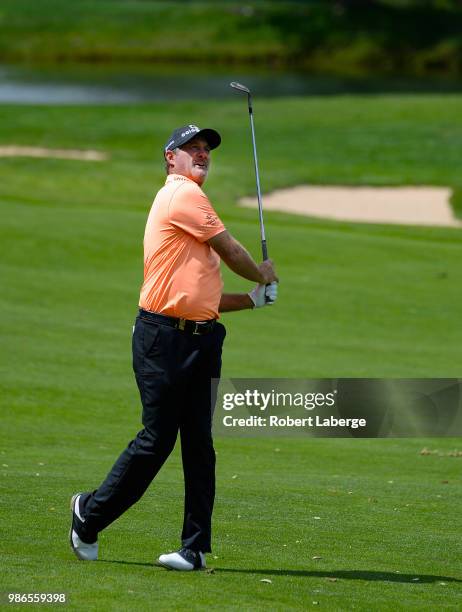 Jerry Kelly makes an approach shot on the fifth hole during round one of the U.S. Senior Open Championship at The Broadmoor Golf Club on June 28,...