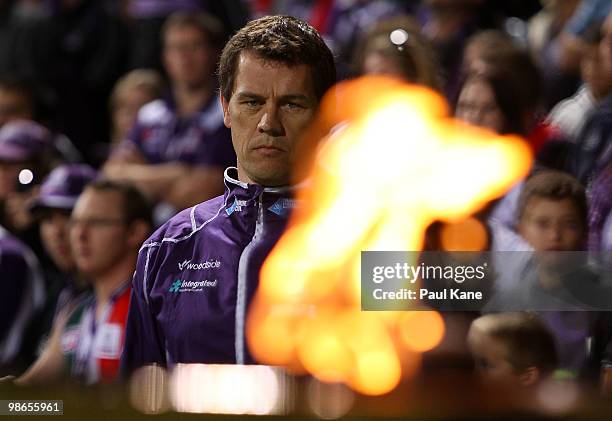 Mark Harvey, coach of the Dockers looks on as a memorial flame is lit during the round five AFL match between the Fremantle Dockers and the Richmond...