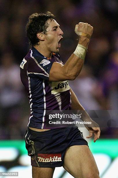 Billy Slater of the Storm celebrates scoring a try during the round seven NRL match between the Melbourne Storm and the Warriors at Etihad Stadium on...