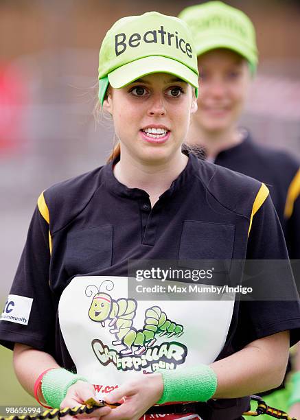 Princess Beatrice of York wears a 'Beatrice' baseball cap as she prepares to run the Virgin London Marathon in the 'Caterpillar Run Team', a team of...