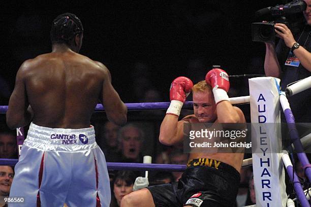 May 2001. Audley Harrison of Great Britain knocks down Mike Middleton of the USA during Harrison's first professional fight at the Wembley Arena,...