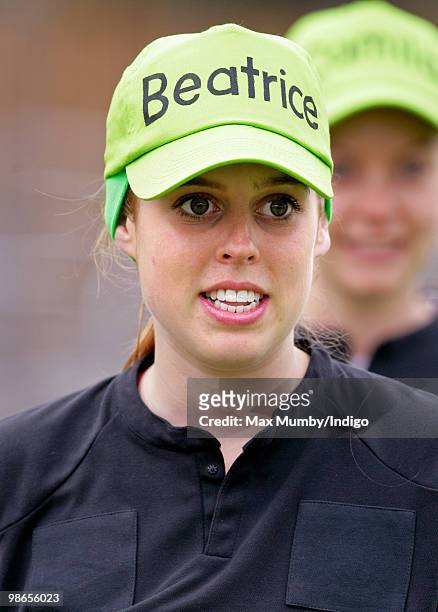 Princess Beatrice of York wears a 'Beatrice' baseball cap as she prepares to run the Virgin London Marathon in the 'Caterpillar Run Team', a team of...