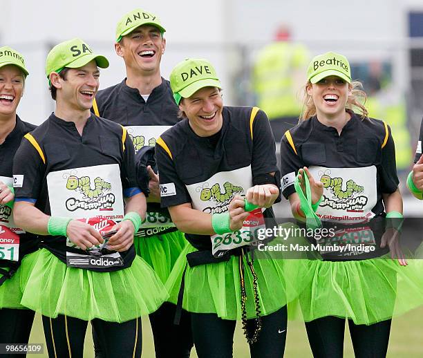 Sam Waley-Cohen, Dave Clark and HRH Princess Beatrice of York wear green tutus and baseball caps as they warm up prior to running the Virgin London...