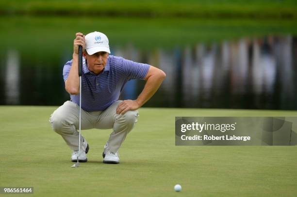 David Toms aims for a putt on the fourth hole during round one of the U.S. Senior Open Championship at The Broadmoor Golf Club on June 28, 2018 in...