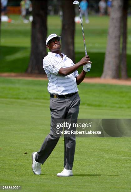 Vijay Singh of Fiji makes an approach shot on the fifth hole during round one of the U.S. Senior Open Championship at The Broadmoor Golf Club on June...
