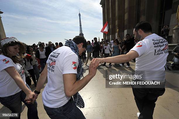 Lebanese laique pride secular activists dance the Dabke - a popular Arabic folk dance - during a demonstration on April 25, 2010 in Paris to promote...