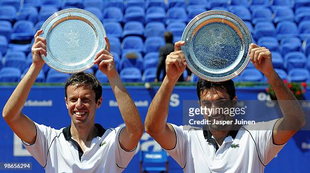 Daniel Nestor of Canada and Nenad Zimonjic of Serbia hold up their winners trophy after the final doubles match against Lleyton Hewitt of Australia...
