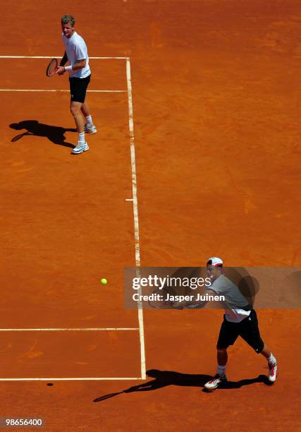 Lleyton Hewitt of Australia plays a double handed backhand flanked by his doubles partner Mark Knowles of the Bahamas during the final doubles match...