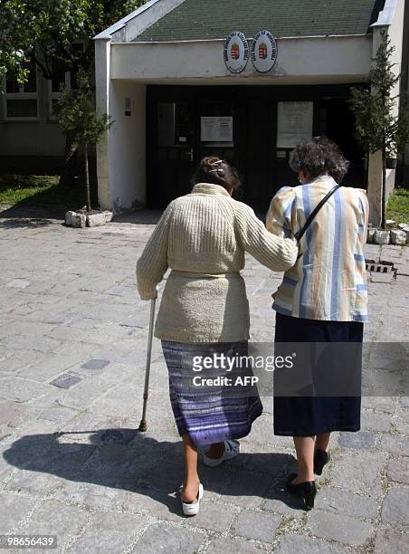 Elderly women arrive to vote at the 93rd polling station of Budapest on April 25, 2010 during the second round of the general election. A...
