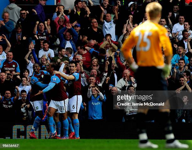 James Milner of Aston Villa celebrates scoring a penalty with Ashley Young, Gabriel Agbonlahor and Stewart Downing during the Barclays Premiership...