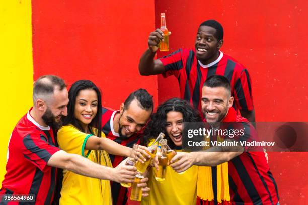 cheerful fans cheering and drinking beer - traditional sport stock pictures, royalty-free photos & images