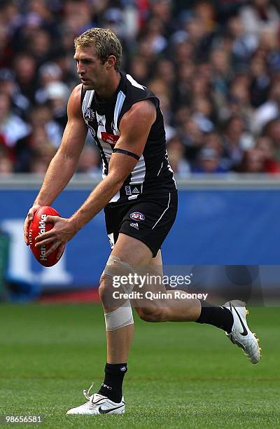 Travis Cloke of the Magpies kicks during the round five AFL match between the Collingwood Magpies and the Essendon Bombers at Melbourne Cricket...