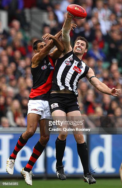 Darren Jolly of the Magpies spoils a mark by Nathan Lovett-Murray of the Bombers during the round five AFL match between the Collingwood Magpies and...