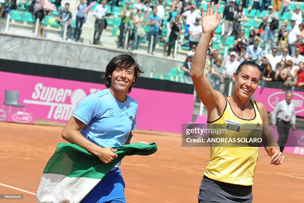 Italy's Flavia Pennetta (R) waves to her