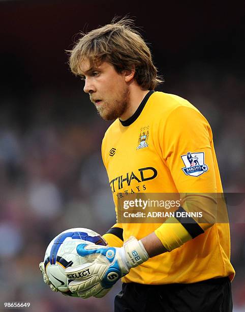 Manchester City's substitute goalkeeper Gunnar Nielsen holds the ball after replacing injured keeper Shay Given against Arsenal during the...