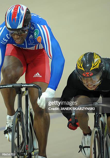 France's Gregory Bauge vies with Malaysia's Azizulhasni Awang in the men's sprint finals-decider during the UCI Track World Championships 2009 on...