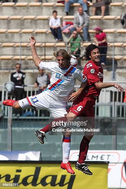 Fabio Galante of AS Livorno Calcio in action against Maximiliano Lopez of Catania Calcio during the Serie A match between AS Livorno Calcio and...