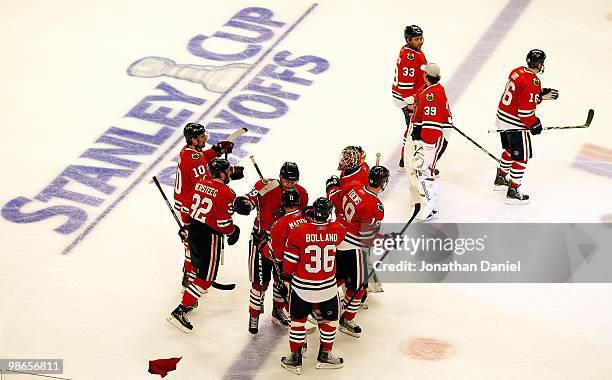 Kris Versteeg, Bryan Bickell, John Madden, Patrick Sharp Dave Bolland and Jonathan Toews of the Chicago Blackhawks congratulate goalie Antti Niemi...