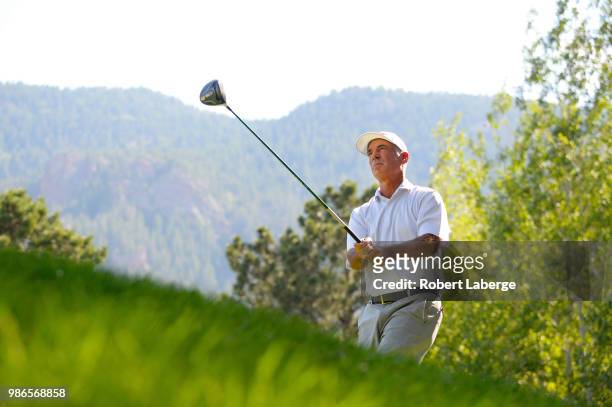Corey Pavin makes a tee shot on the 10th hole during round one of the U.S. Senior Open Championship at The Broadmoor Golf Club on June 28, 2018 in...