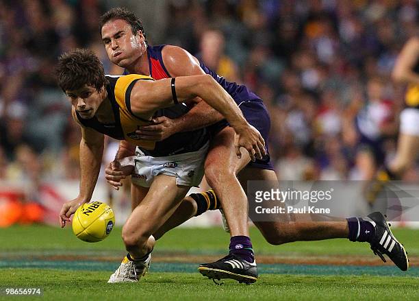 Paul Hasleby of the Dockers tackles Trent Cotchin of the Tigers during the round five AFL match between the Fremantle Dockers and the Richmond Tigers...