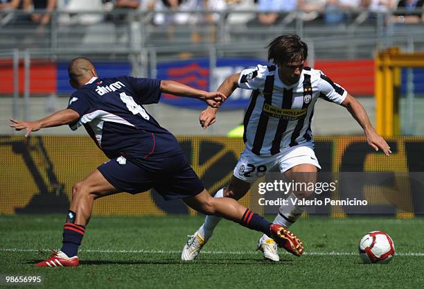 Ribas Da Cunha Diego of Juventus FC competes for the ball with Sergio Bernardo Almiron of AS Bari during the Serie A match between Juventus FC and AS...