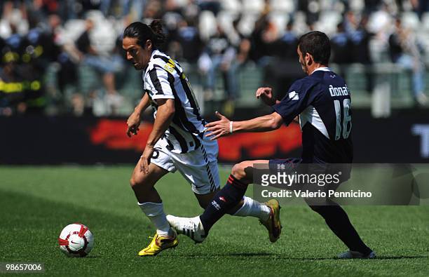 Mauro German Camoranesi of Juventus FC is challenged by Massimo Donati of AS Bari during the Serie A match between Juventus FC and AS Bari at Stadio...