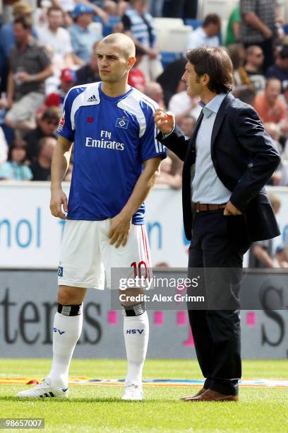 Head coach Bruno Labbadia of Hamburg talks to Mladen Petric before the Bundesliga match between 1899 Hoffenheim and Hamburger SV at the Rhein-Neckar...