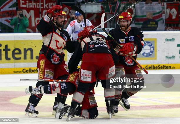 Chris Herperger, Andre Reiss and Adam Mitchel of Hannover celebrate their team's 2nd goal during the DEL play off final match between Hannover...