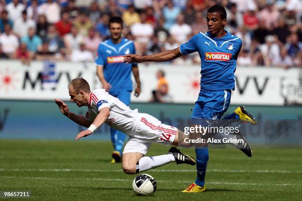 David Jarolim of Hamburg is challenged by Luiz Gustavo of Hoffenheim during the Bundesliga match between 1899 Hoffenheim and Hamburger SV at the...