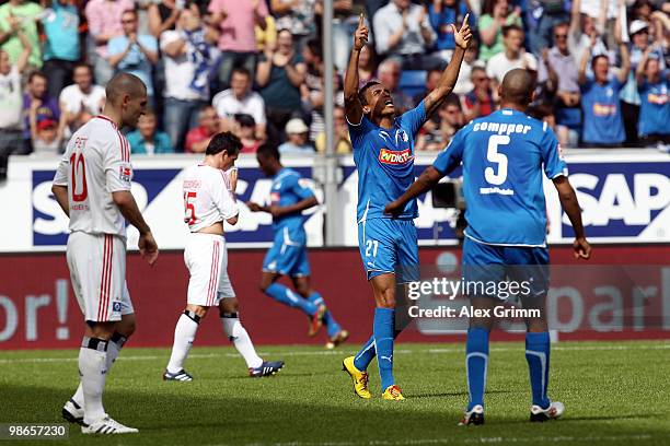 Chinedu Obasi of Hoffenheim celebrates his team's third goal with team mates Luiz Gustavo and Marvin Compper as Mladen Petric and Piotr Trochowski of...