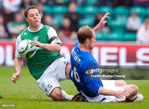 John Rankin of Hibernian competes with Steven Whittaker of Rangers during the Clydesdale Bank Scottish Premier League match between Hibernian and...