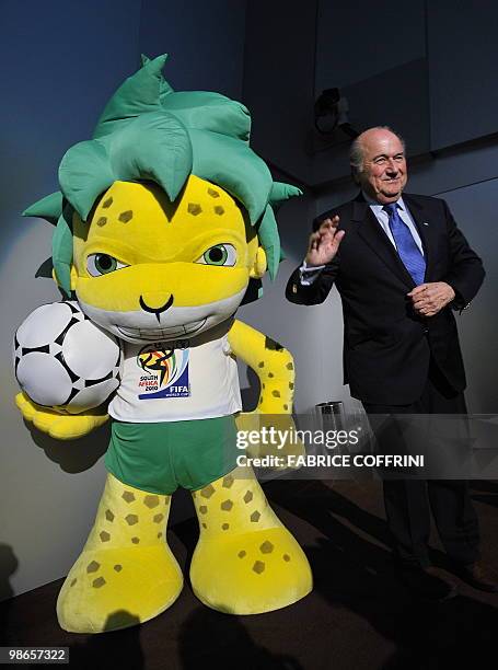 President Sepp Blatter gestures next to Zakumi, the FIFA 2010 World Cup mascot, after a press conference on April 23, 2010 at the World's governing...