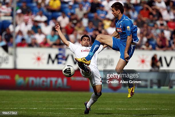 Tomas Rincon of Hamburg is challenged by Vedad Ibisevic of Hoffenheim during the Bundesliga match between 1899 Hoffenheim and Hamburger SV at the...