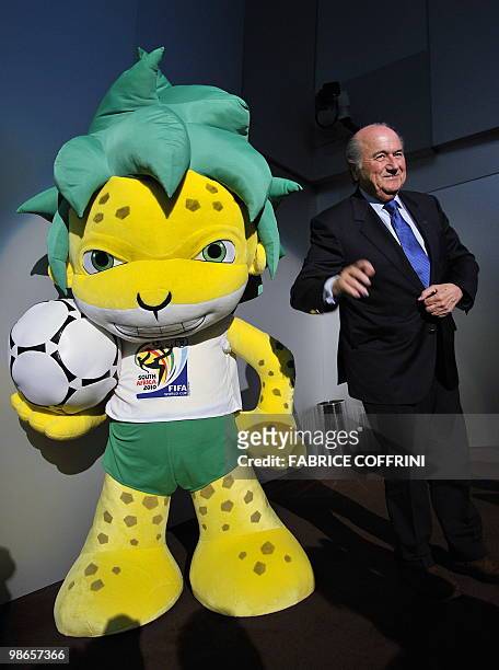 President Sepp Blatter gestures with Zakumi, the FIFA 2010 World Cup mascot, after a press conference on April 23, 2010 at the World's governing body...