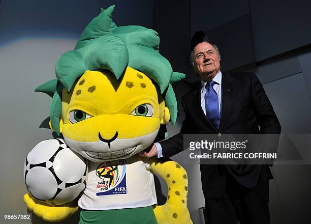 President Sepp Blatter gestures next to Zakumi, the FIFA 2010 World Cup mascot, after a press conference on April 23, 2010 at the World's governing...