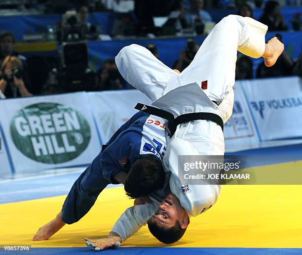 Belgium's Dirk Van Tichelt vies with Hungary's Attila Ungvari for bronze in men's 73 kg event during Judo EURO2010 European championships in Vienna...