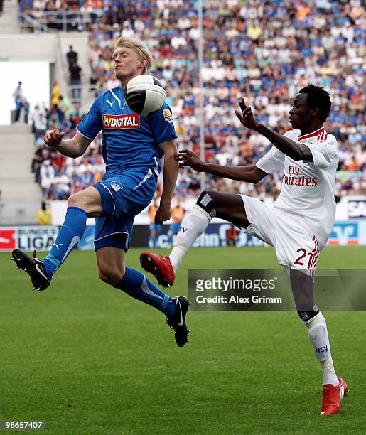 Jonathan Pitroipa of Hamburg is challenged by Andreas Beck of Hoffenheim during the Bundesliga match between 1899 Hoffenheim and Hamburger SV at the...