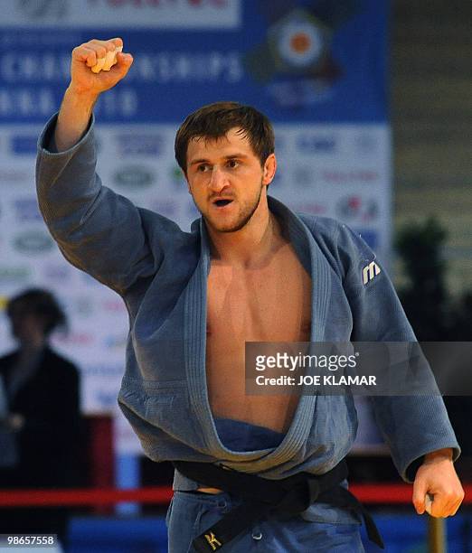 Russia's Sirazhudin Magomedov celebrates his victory over Belarus' Aliaksandr Stsiashenka after they competed for gold medal in the men's 81 kg event...