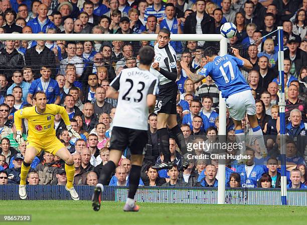 Tim Cahill of Everton attempts a header towards the Fulham goal during the Barclays Premier League match between Everton and Fulham at Goodison Park...