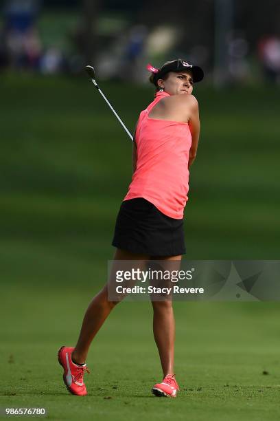 Lexi Thompson hits her approach shot on the ninth hole during the first round of the KPMG Women's PGA Championship at Kemper Lakes Golf Club on June...