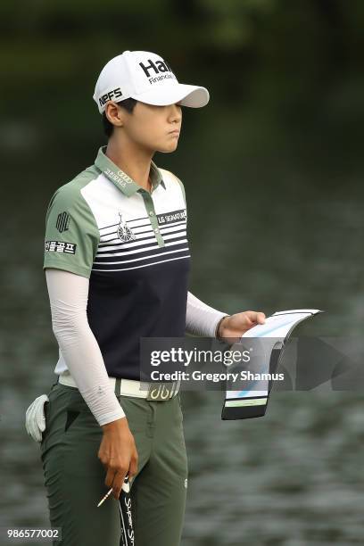 Sung Hyun Park of Korea checks her yardage book on the 16th green during the first round of the 2018 KPMG PGA Championship at Kemper Lakes Golf Club...
