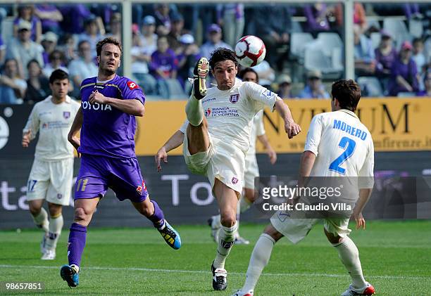 Alberto Gilardino of ACF Fiorentina competes for the ball with Davide Mandelli of AC Chievo Verona during the Serie A match between ACF Fiorentina...