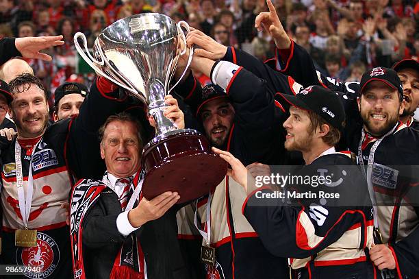 Hans Zach, head coach of Hannover celebrates with the trophy after winning the DEL play off final match between Hannover Scorpions and Augsburger...