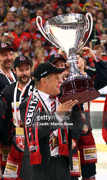 Hans Zach, head coach of Hannover celebrates with the trophy after winning the DEL play off final match between Hannover Scorpions and Augsburger...