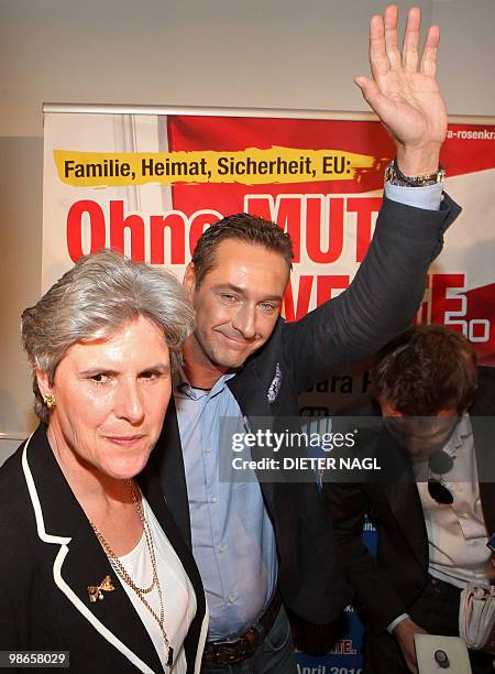 Far-right Freedom Party 's presidential candidate Barbara Rosenkranz looks on as Party Leader Heinz Christian Strache waves at the FPOe's headquaters...