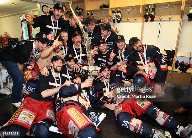 The team of Hannover celebrates with the trophy after winning the DEL play off final match between Hannover Scorpions and Augsburger Panther at TUI...