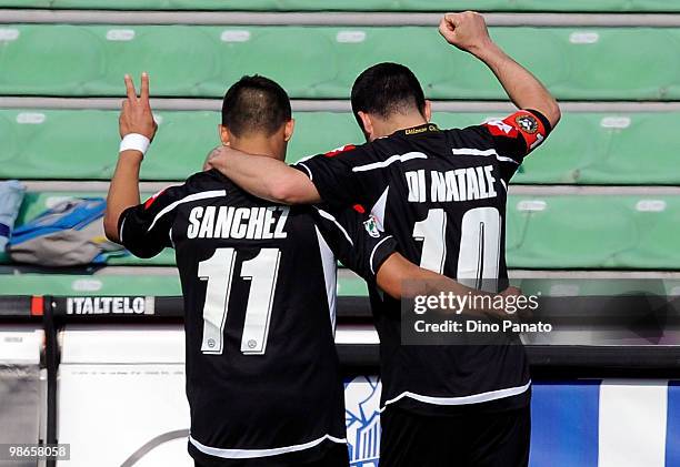 Antonio Di Natale of Udinese celebrates with team mate Alexis Alejandro Sanchez after scoring his team's fourth goal during the Serie A match between...