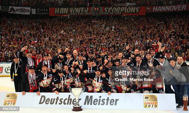The team of Hannover celebrates with the trophy after winning the DEL play off final match between Hannover Scorpions and Augsburger Panther at TUI...