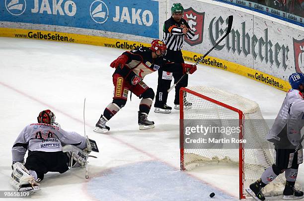 Thomas Dolak of Hannover scores his team's winning goal during the DEL play off final match between Hannover Scorpions and Augsburger Panther at TUI...