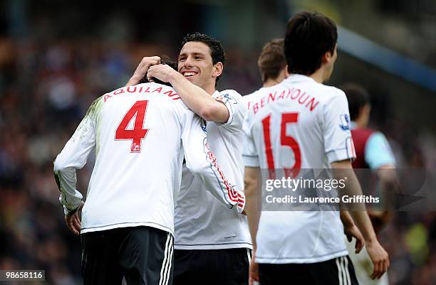 Maxi Rodriguez of Liverpool celebrates scoring his team's third goal with his team mates during the Barclays Premier League match between Burnley and...